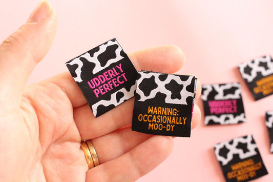 UDDERLY PERFECT / OCCASIONALLY MOO-DY | Cow Print Double Sided Woven Sewing Labels (6 Pack) - The Cosy Club Handmade