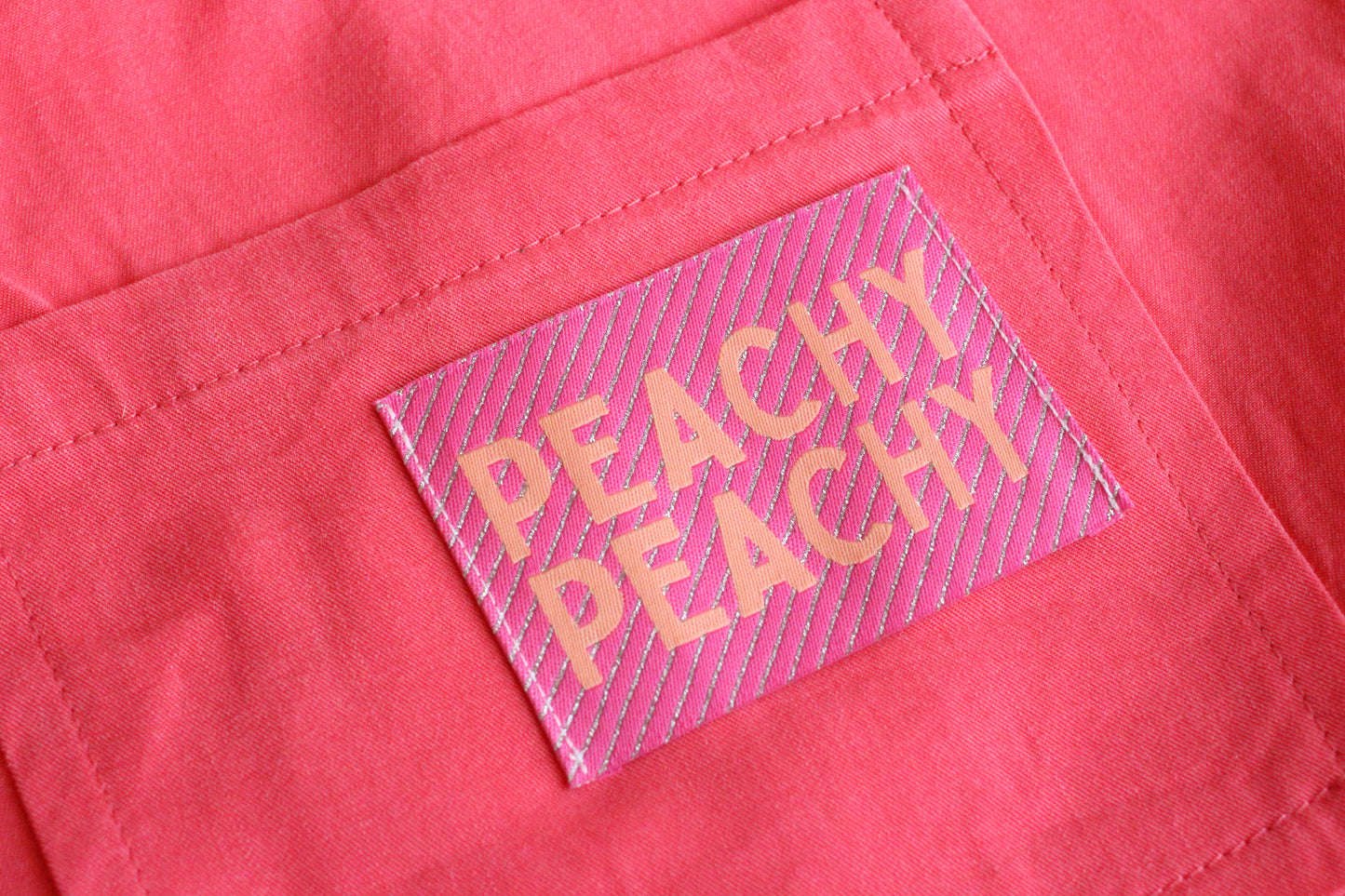 Large Peachy Peach woven sewing labels by The Cosy Club Handmade, featuring colorful, textured fabric tags for crafting projects.