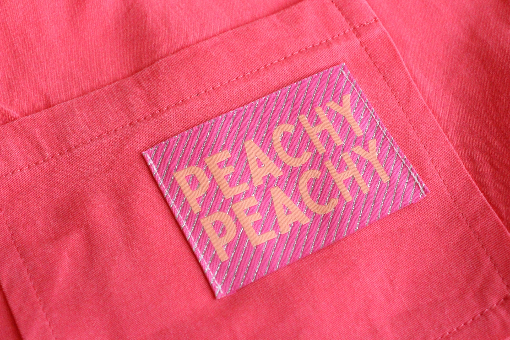 Large Peachy Peach woven sewing labels by The Cosy Club Handmade, featuring colorful, textured fabric tags for crafting projects.