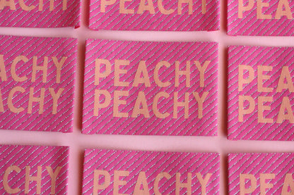 Large Peachy Peach sewing labels from The Cosy Club Handmade, woven fabric labels for clothing or craft projects.