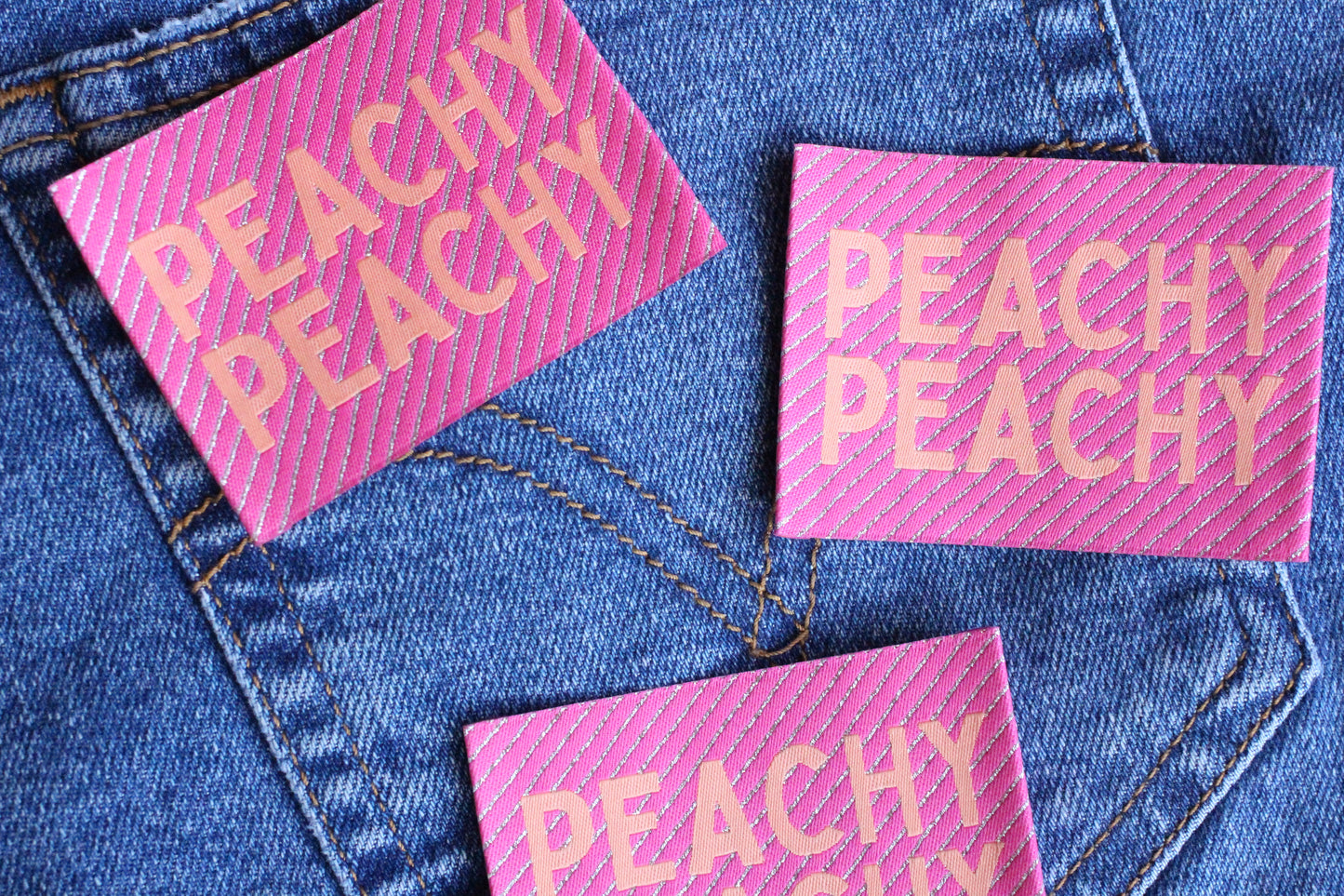 Large Peachy Peach woven sewing labels by The Cosy Club Handmade, showcasing colorful, textured fabric labels for sewing projects.