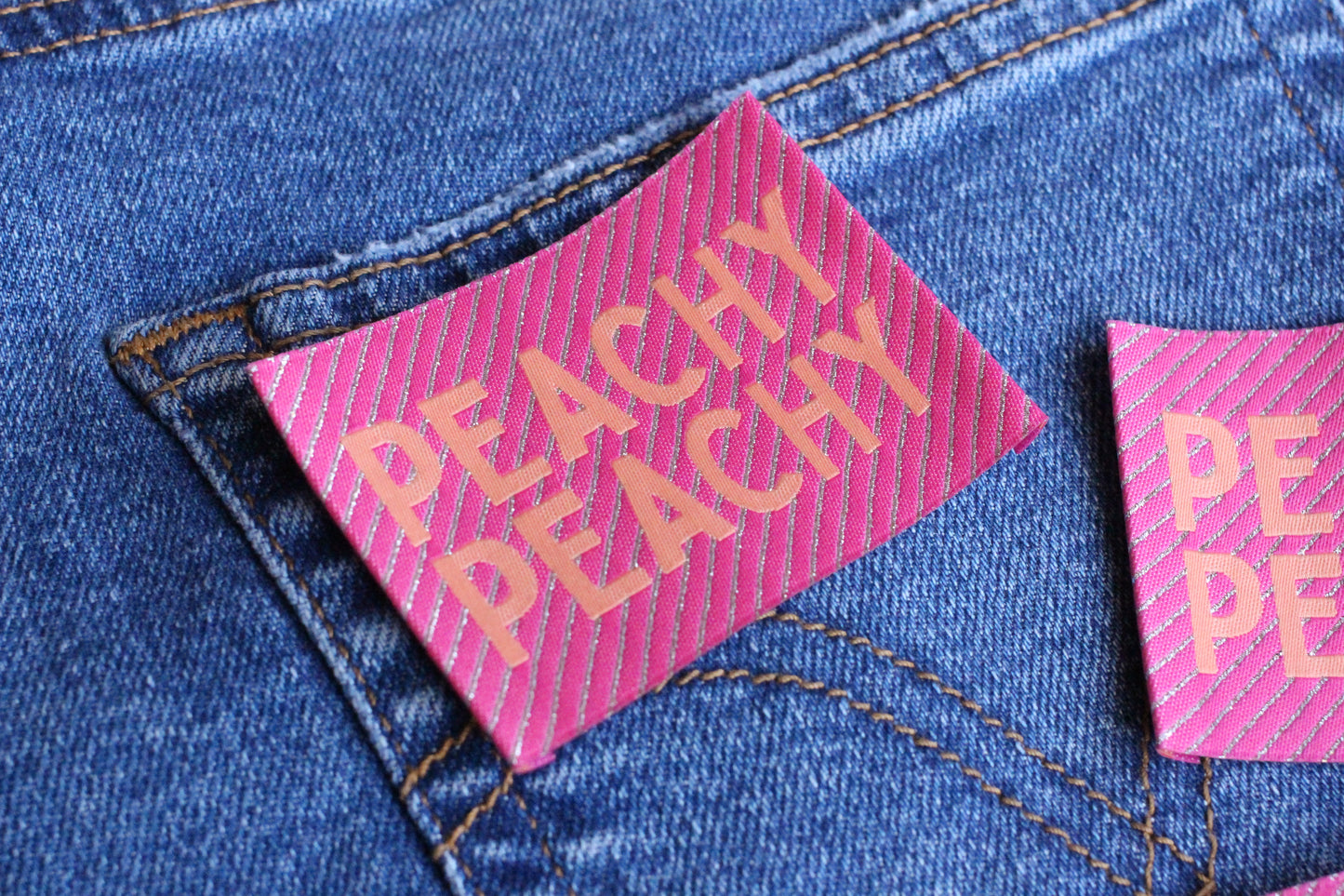 Large Peachy Peach sewing labels by The Cosy Club Handmade, woven fabric with decorative edges for clothing or craft projects.