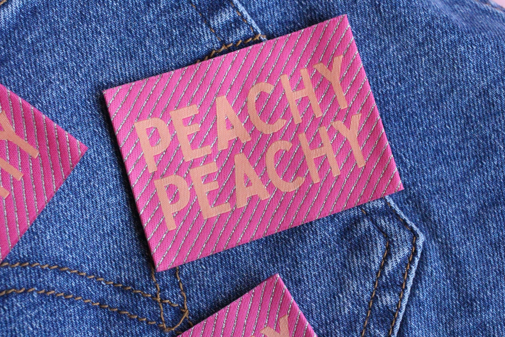 Peachy Peach large woven sewing labels from The Cosy Club Handmade, showing four neatly stitched fabric labels with branding.