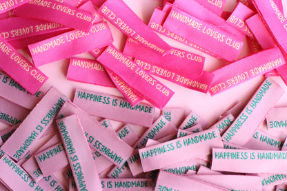 Handmade sewing labels with "Happiness is Handmade" text, six side seam labels from The Cosy Club Handmade.