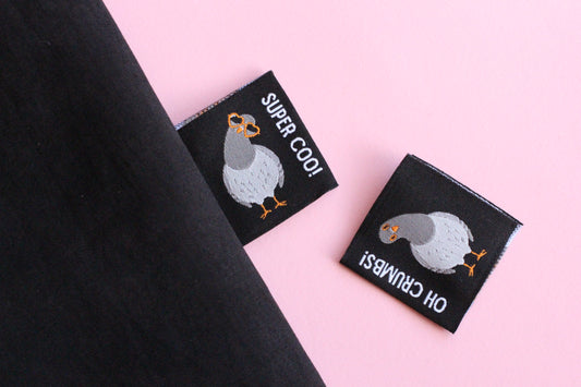 Double-sided Pigeon Sewing Labels by The Cosy Club Handmade, featuring six durable fabric labels for sewing and craft projects.