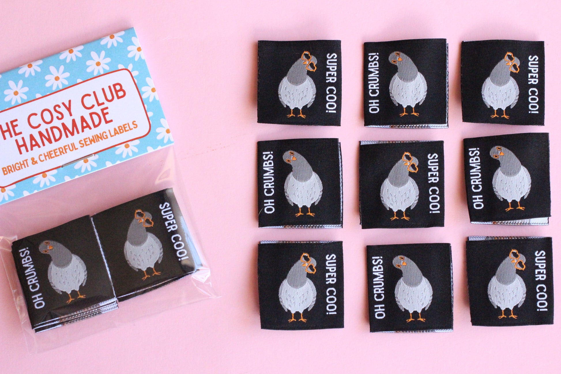 Double-sided Pigeon Sewing Labels from The Cosy Club Handmade, featuring six sets of small, fabric labels for sewing and craft projects.