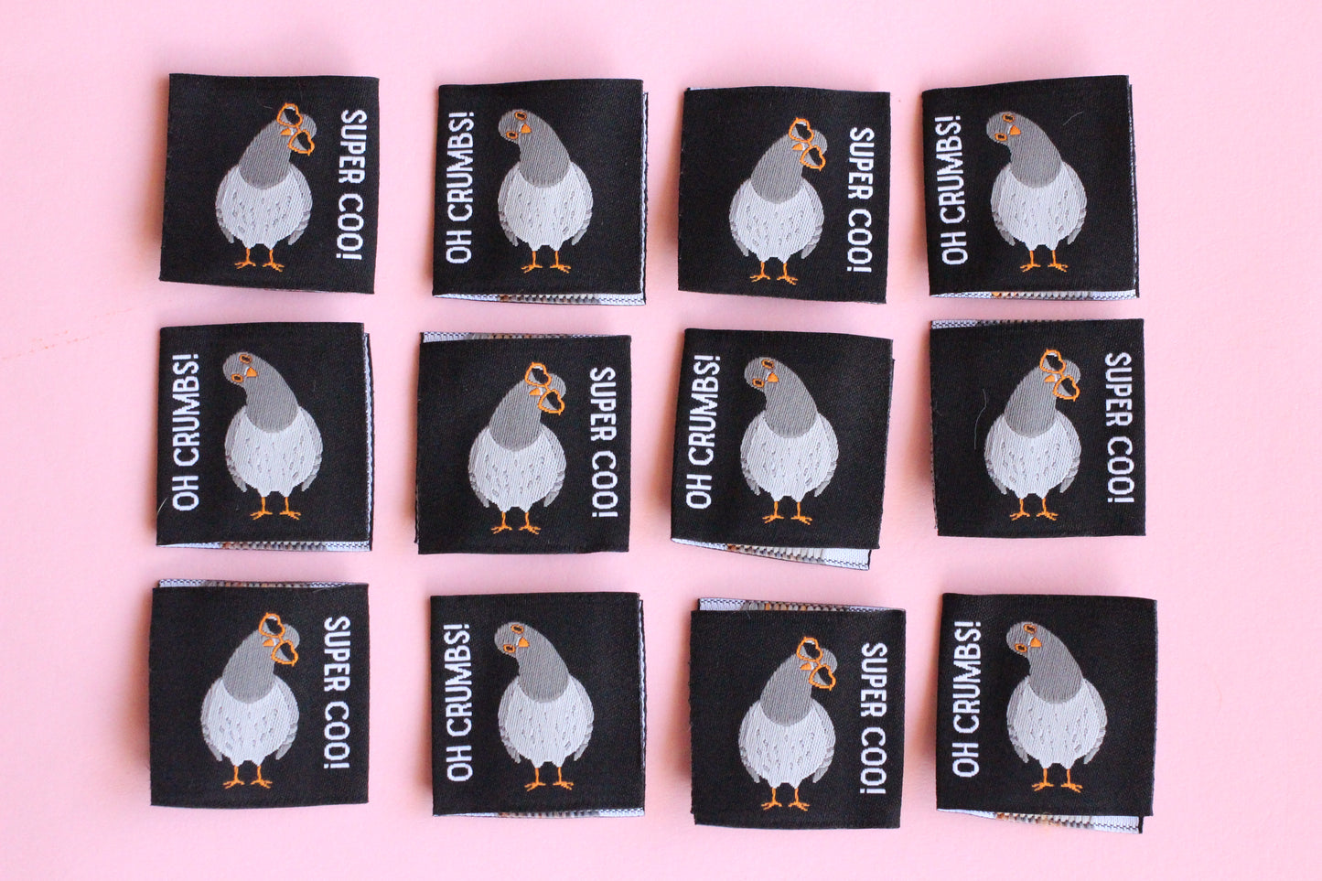 Double-sided Pigeon sewing labels from The Cosy Club Handmade, featuring six versatile fabric tags for clothing and craft projects.