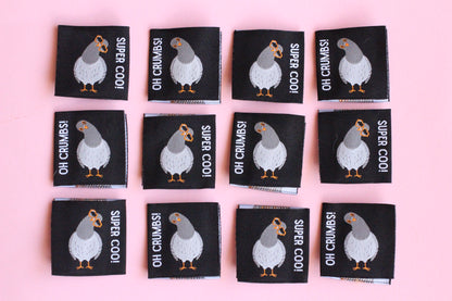 Double-sided Pigeon sewing labels from The Cosy Club Handmade, featuring six versatile fabric tags for clothing and craft projects.