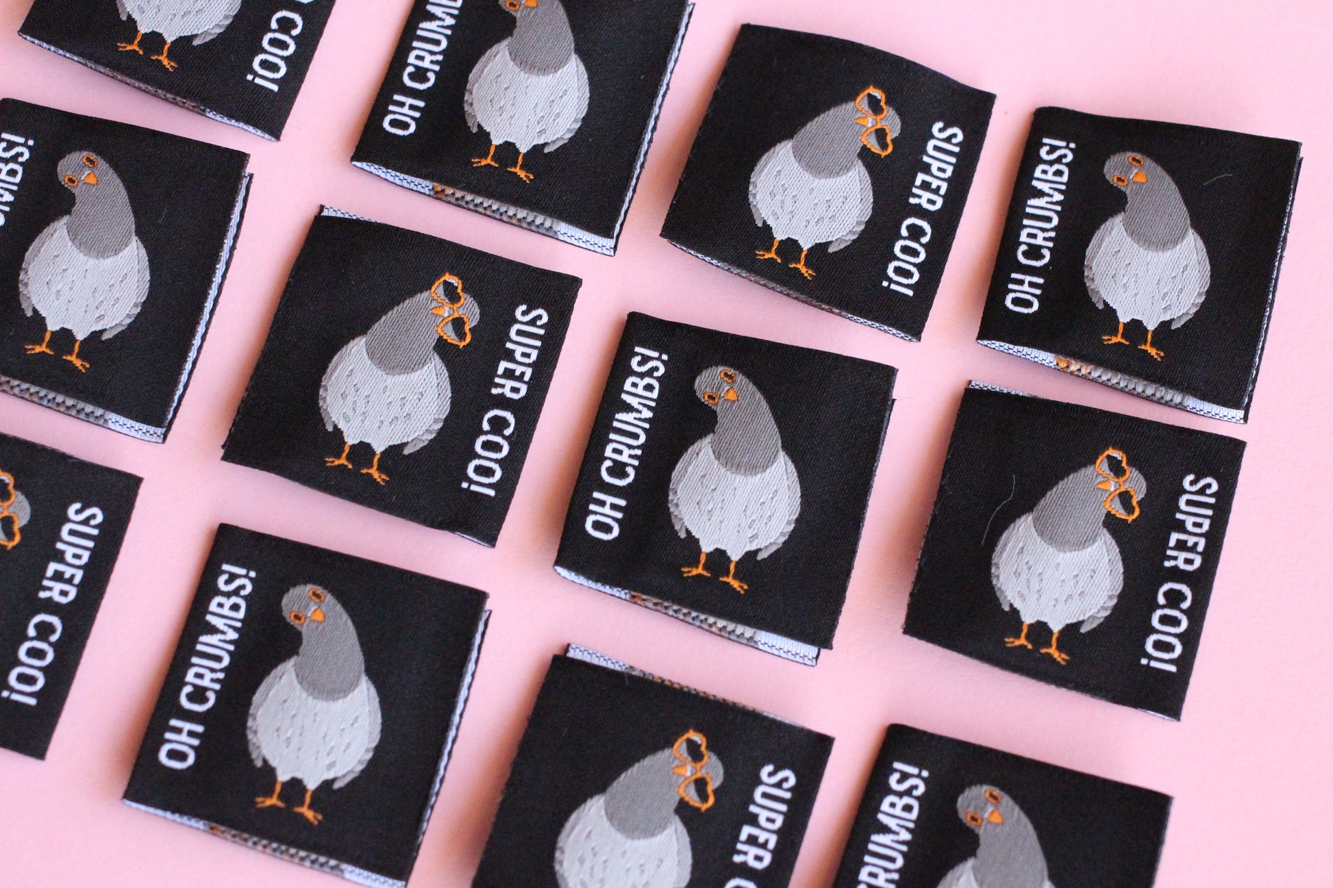 Double-sided Pigeon Sewing Labels from The Cosy Club Handmade, featuring six fabric labels with detailed stitching.