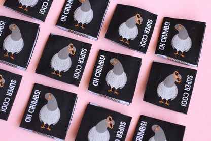 Double-sided Pigeon Sewing Labels from The Cosy Club Handmade, featuring six fabric labels with detailed stitching.