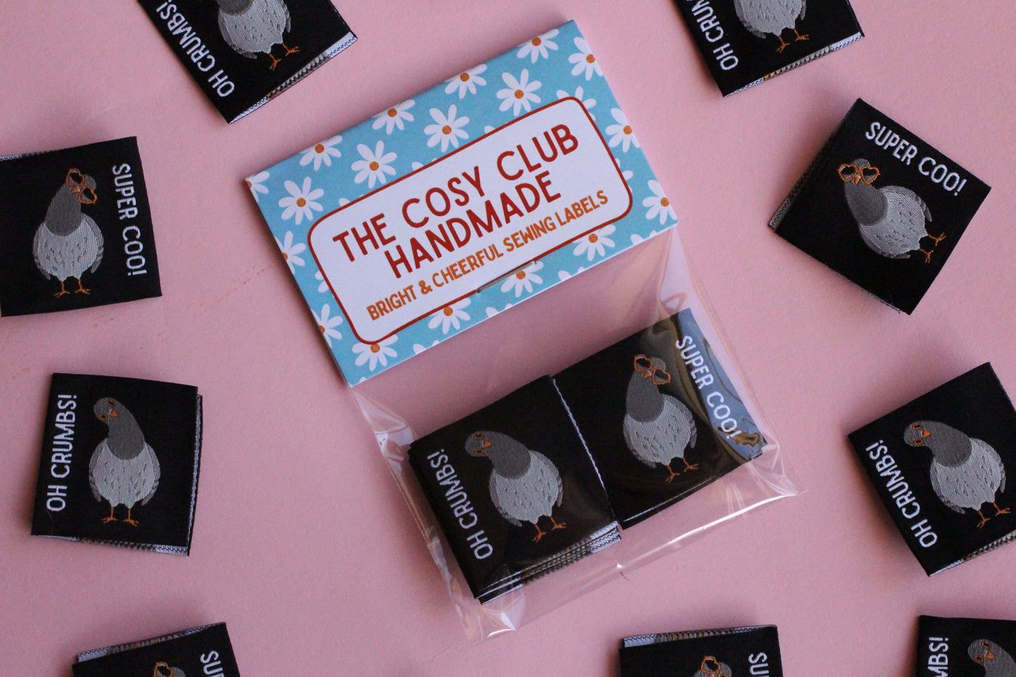Double-sided Pigeon Sewing Labels from The Cosy Club Handmade, with six durable fabric labels for sewing projects.