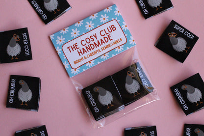 Double-sided Pigeon Sewing Labels from The Cosy Club Handmade, with six durable fabric labels for sewing projects.
