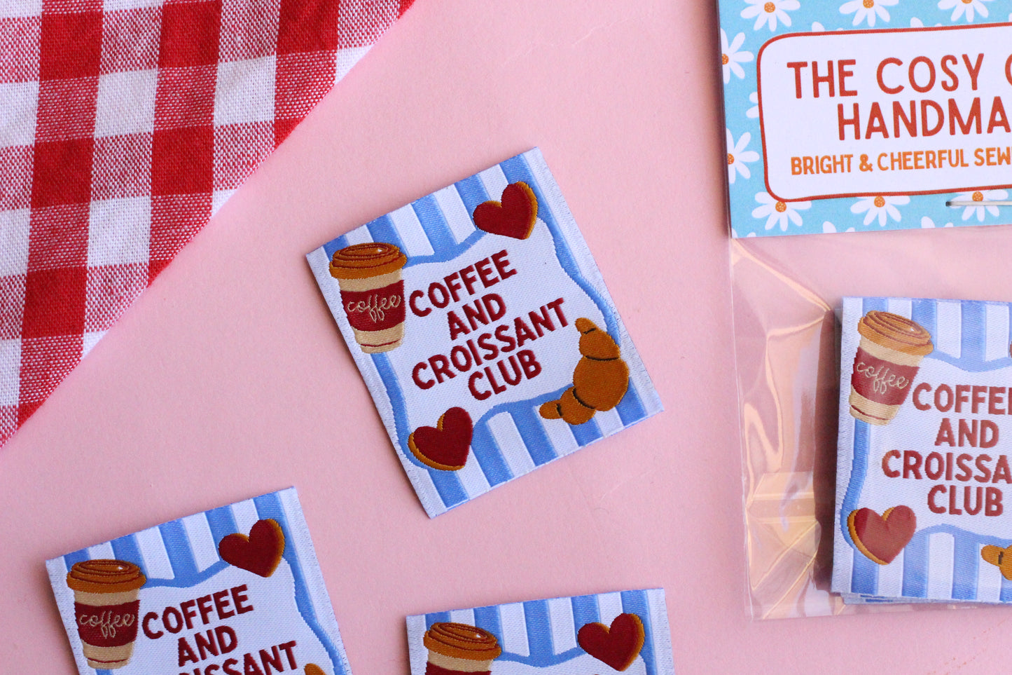 Set of five sewing labels featuring coffee and croissant designs by The Cosy Club Handmade for fabric embellishments.