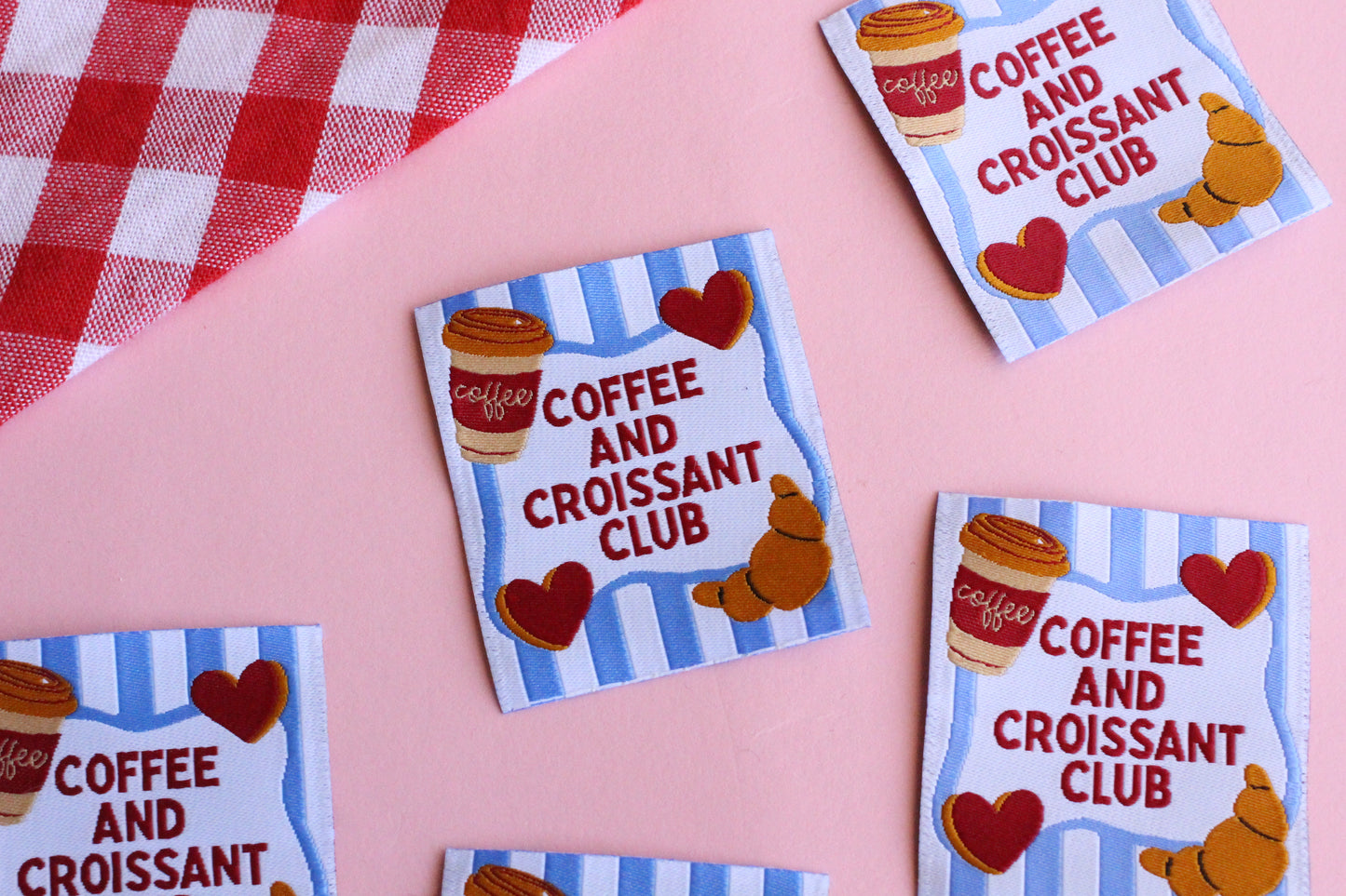 Set of five sewing labels from The Cosy Club Handmade featuring coffee and croissant designs for craft and clothing projects.
