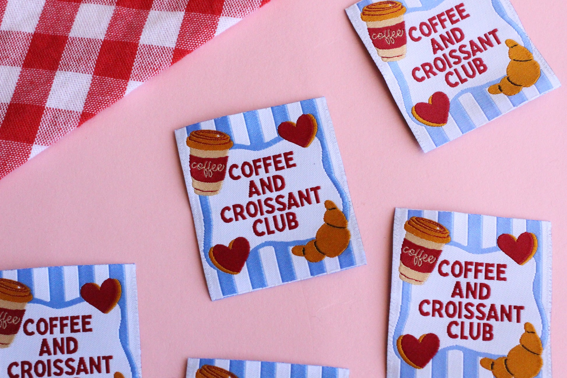 Set of five sewing labels from The Cosy Club Handmade featuring coffee and croissant designs for craft and clothing projects.
