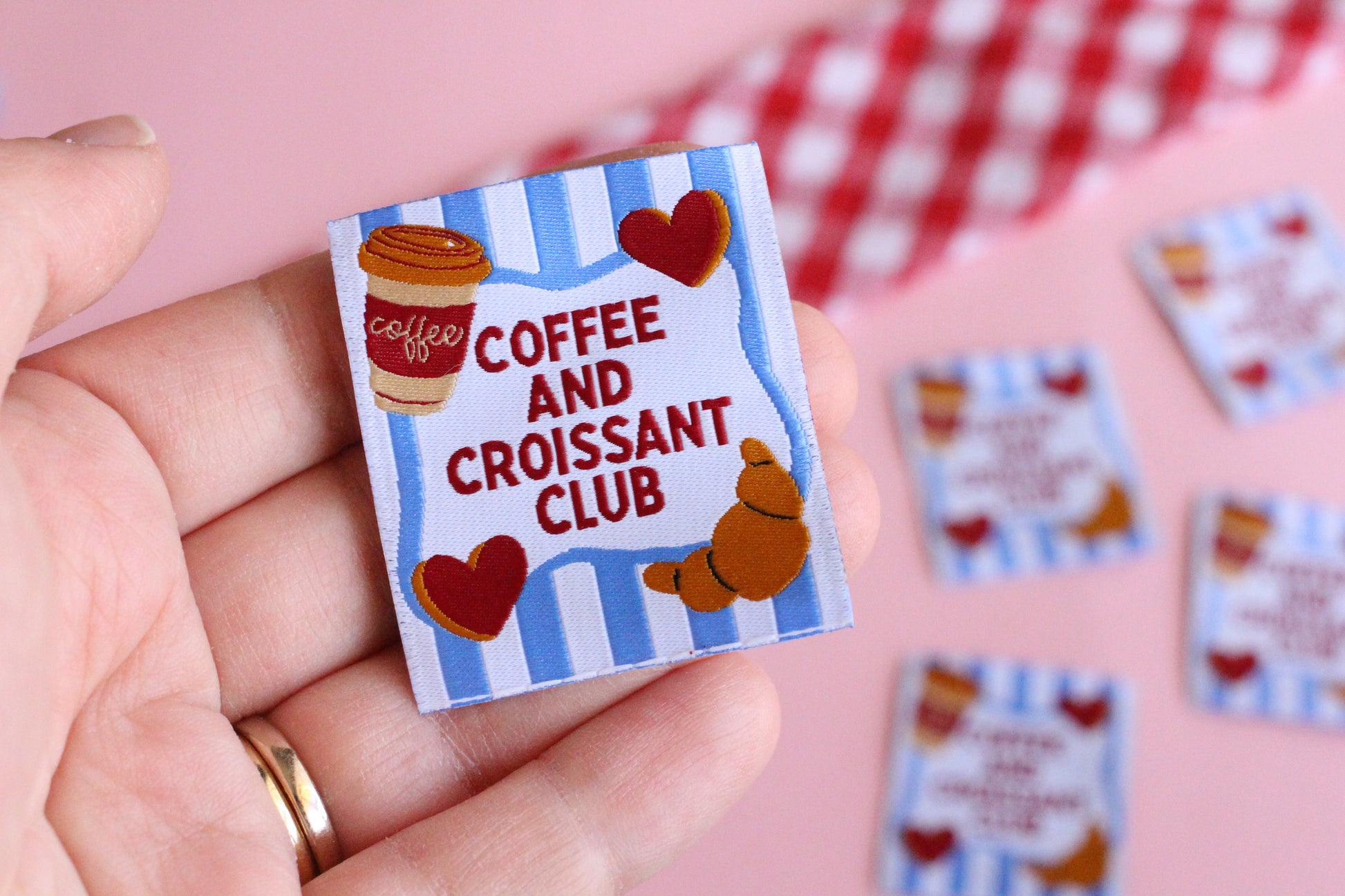 Set of five sewing labels from The Cosy Club Handmade featuring coffee and croissant designs for craft or clothing projects.