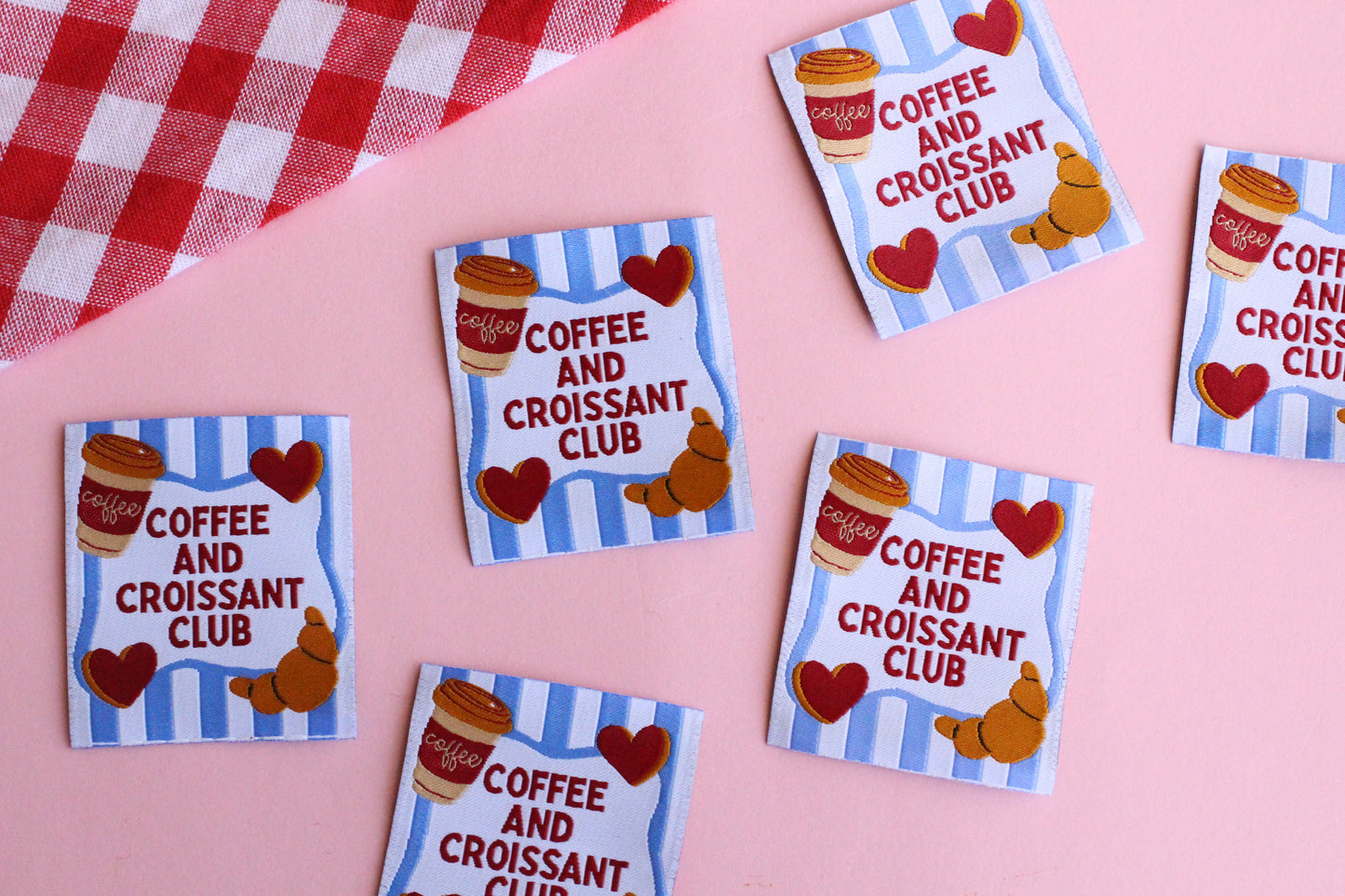 Set of five sewing labels featuring Coffee and Croissant Club design by The Cosy Club Handmade, ideal for personalized craft projects.
