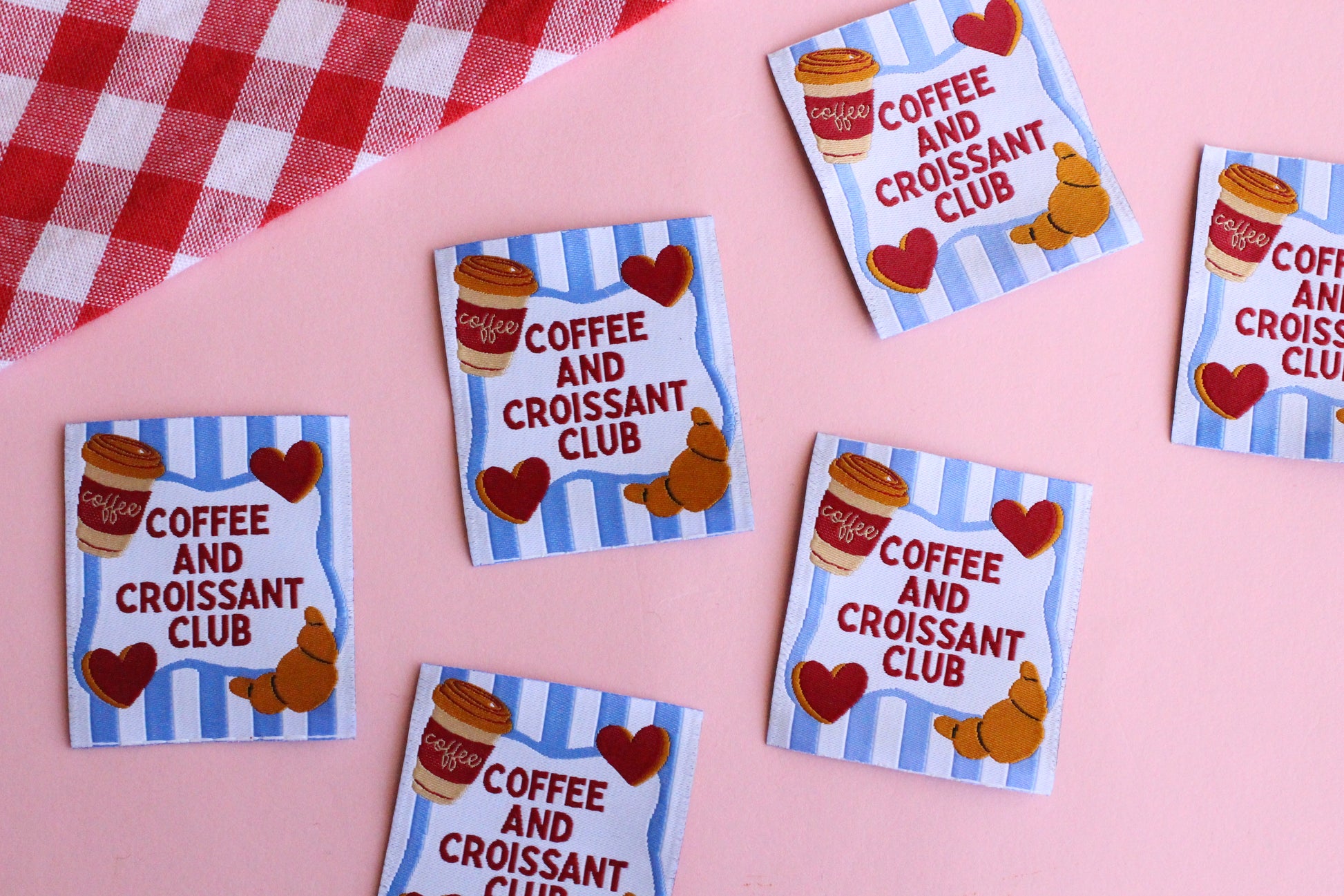 Set of five sewing labels featuring Coffee and Croissant Club design by The Cosy Club Handmade, ideal for personalized craft projects.