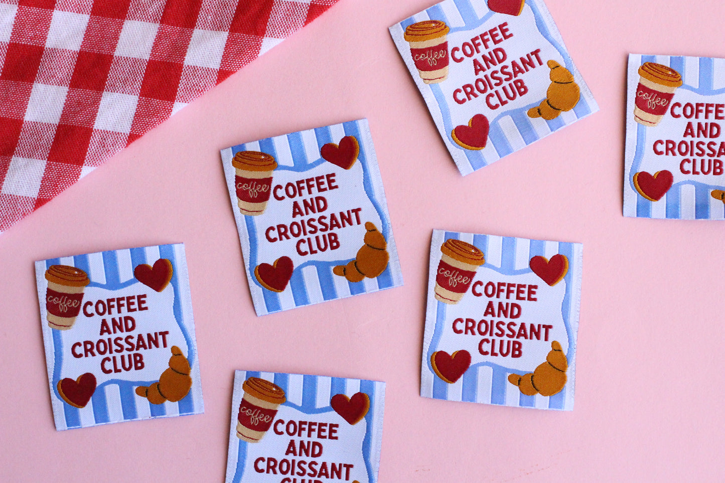 Set of five sewing labels featuring coffee and croissant designs from The Cosy Club Handmade, perfect for sewing projects.