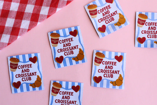 Set of five sewing labels featuring coffee and croissant designs from The Cosy Club Handmade, perfect for sewing projects.