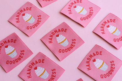 Five handmade cupcake sewing labels from The Cosy Club Handmade, featuring colorful embroidered cupcake designs on fabric.