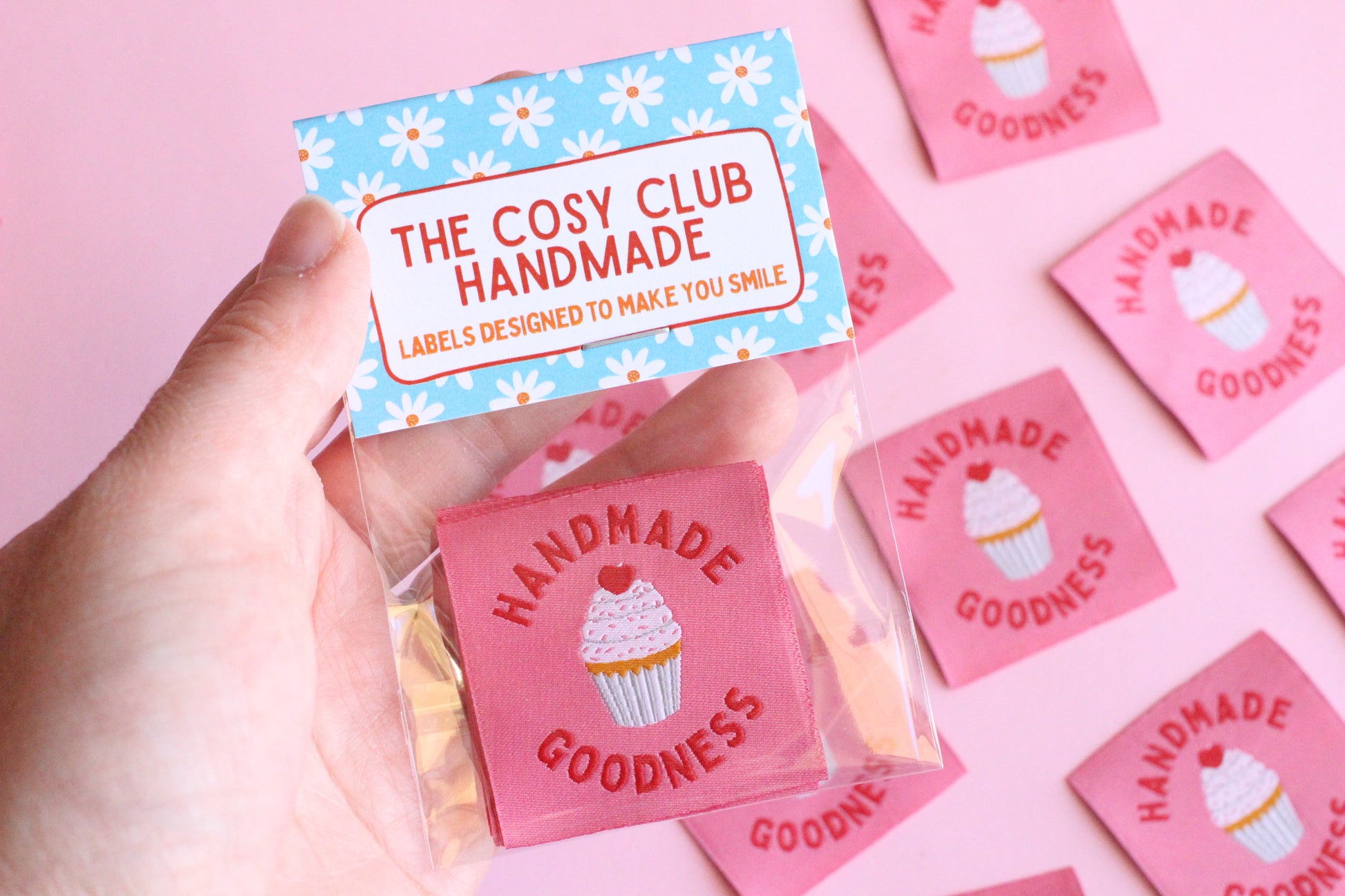 Handmade Goodness cupcake-shaped sewing labels from The Cosy Club Handmade, featuring five colorful embroidered labels on a plain background.