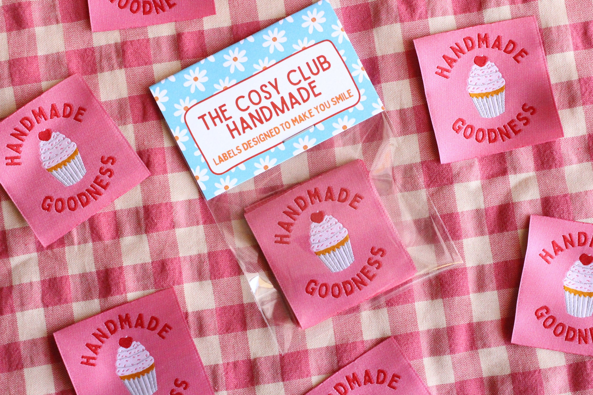 Handmade Goodness 5 cupcake-shaped sewing labels by The Cosy Club Handmade, featuring colorful embroidered cupcake designs.