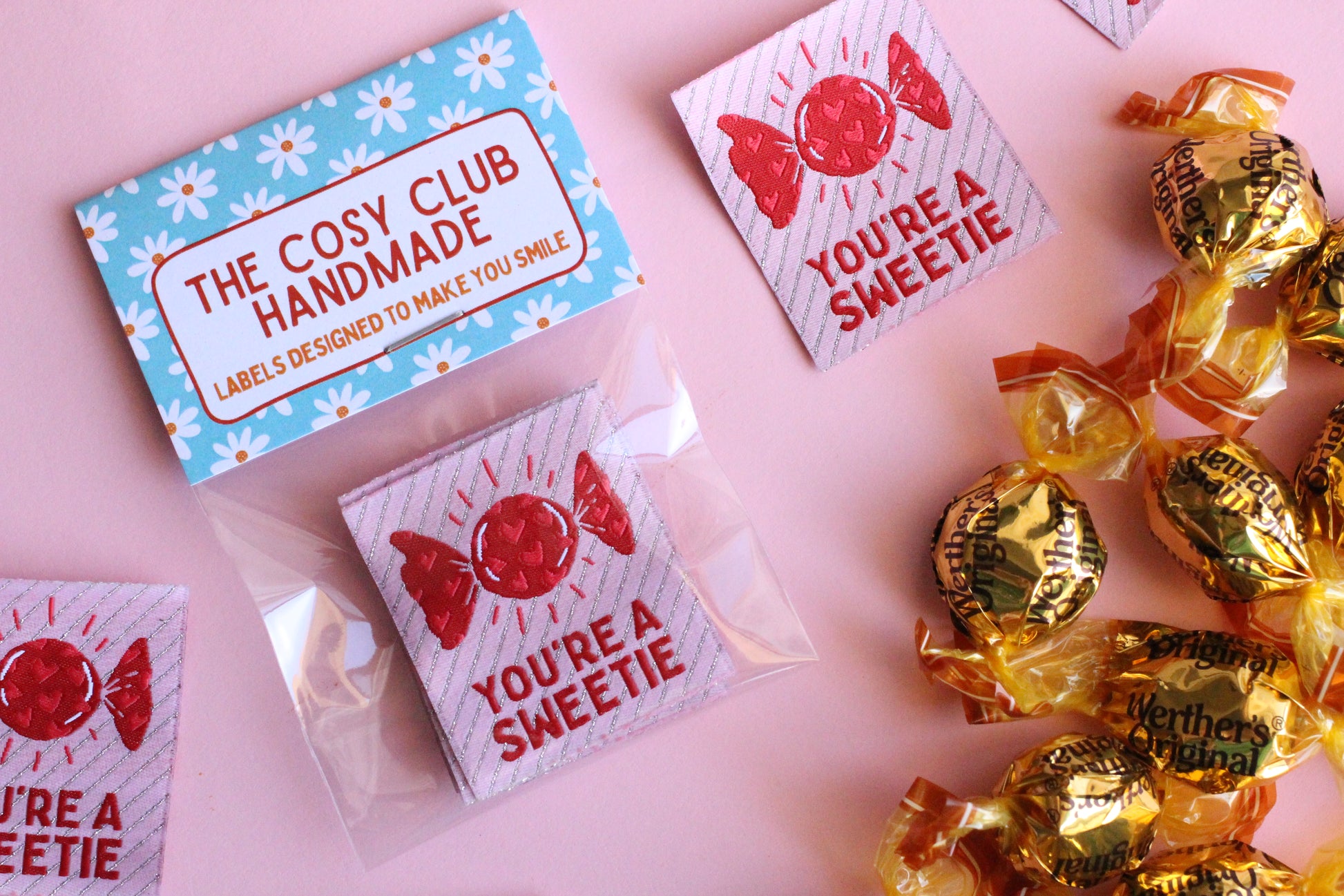 Colorful fabric sewing labels reading "You're a SWEETIE" by The Cosy Club Handmade, designed for craft and sewing projects.