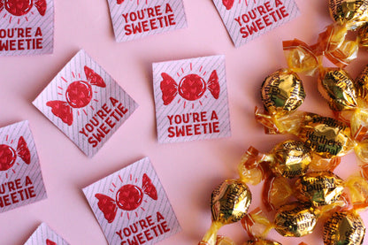 Set of five "You're a SWEETIE" candy-themed sewing labels by The Cosy Club Handmade, featuring colorful candy illustrations.