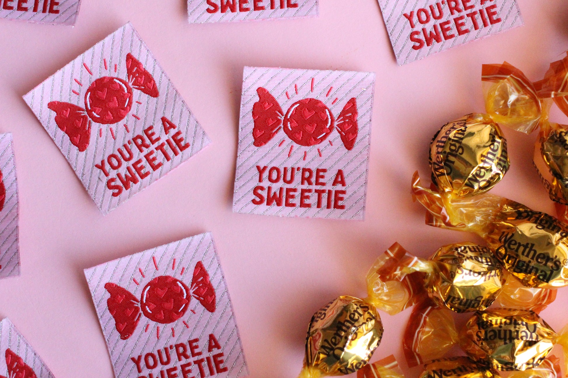 Set of five colorful fabric sewing labels with "You're a SWEETIE" message from The Cosy Club Handmade, perfect for sewing projects.