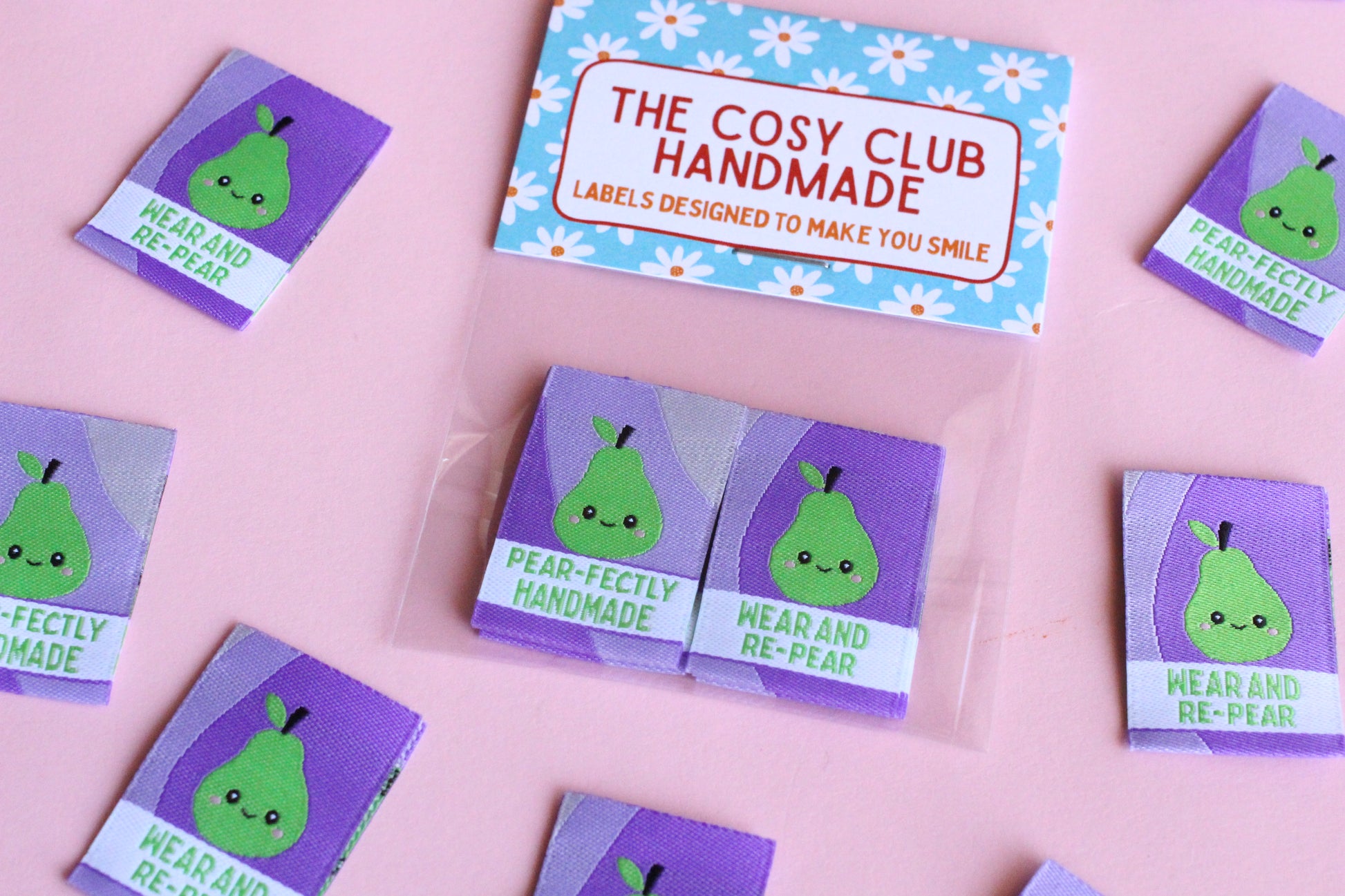 Handmade double-sided woven labels from The Cosy Club Handmade, featuring intricate weaving and a PEAR-fectly crafted design.