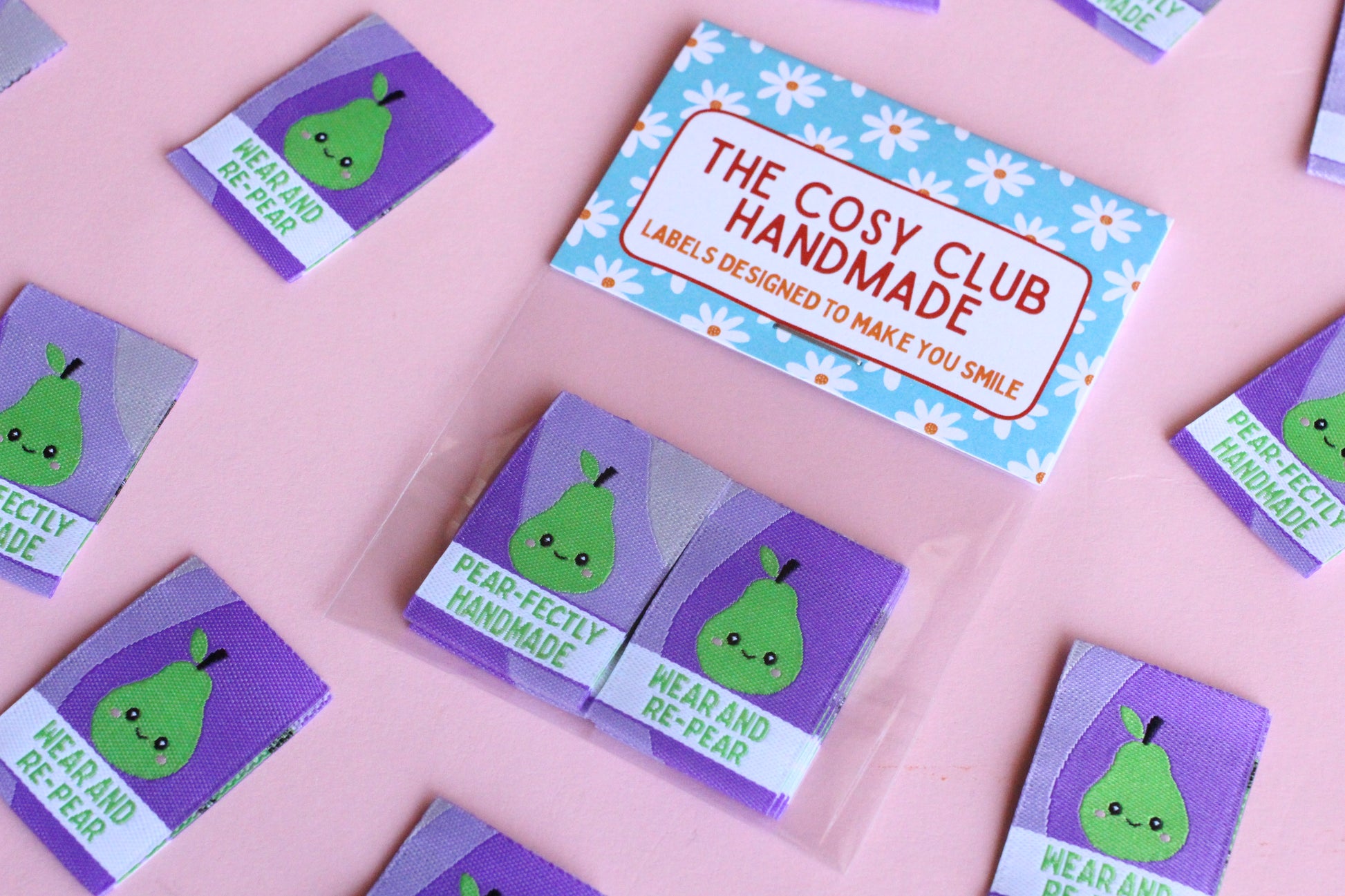Six double-sided woven labels from PEAR-fectly Handmade by The Cosy Club Handmade, featuring intricate woven patterns and branding.