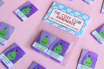 Six double-sided woven labels from PEAR-fectly Handmade by The Cosy Club Handmade, featuring intricate woven patterns and branding.