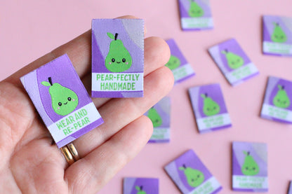 Six double-sided woven labels from PEAR-fectly Handmade by The Cosy Club Handmade, showing intricate woven patterns and branding.