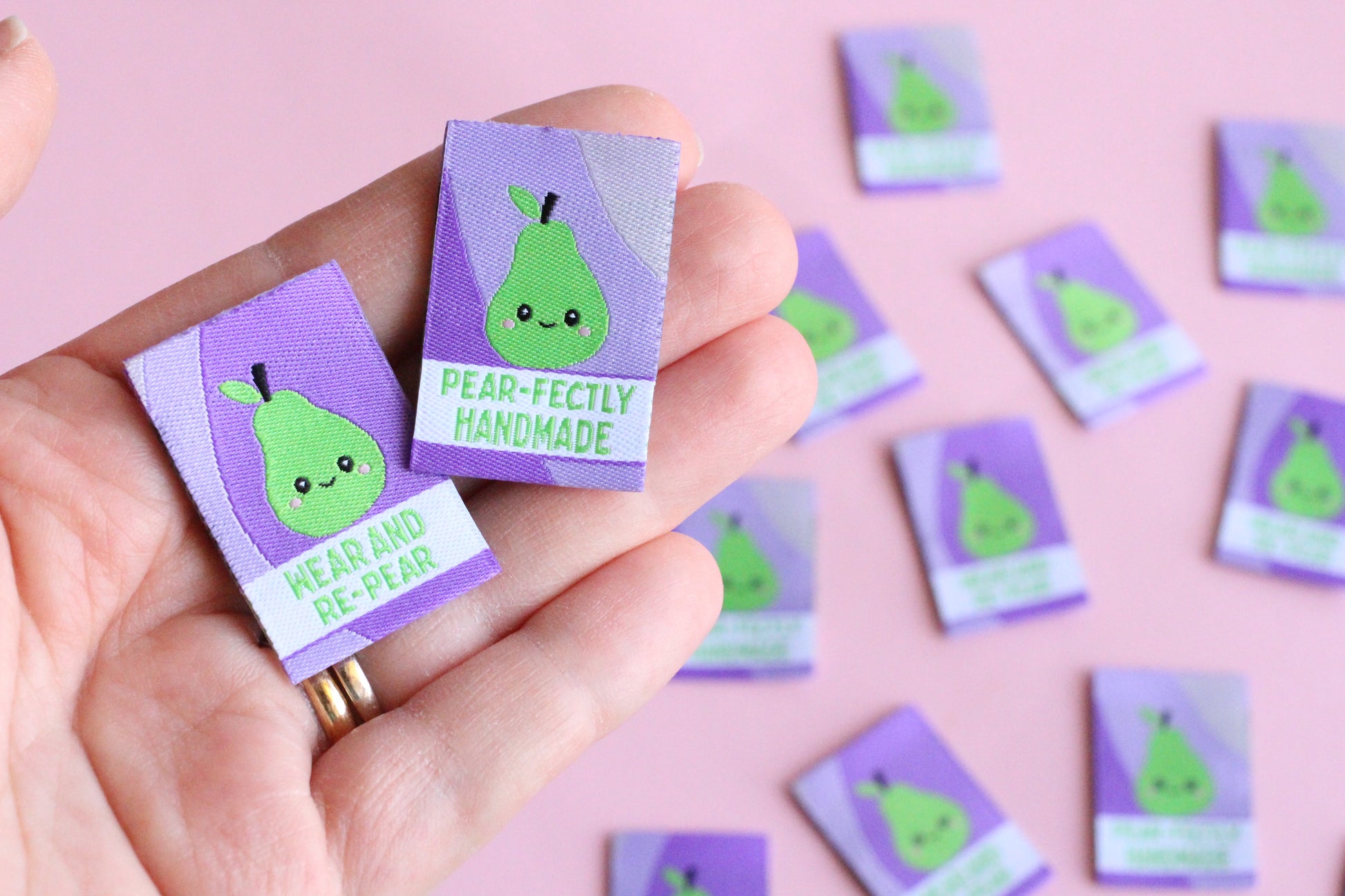 Six double-sided woven labels from PEAR-fectly Handmade by The Cosy Club Handmade displayed on a neutral background.
