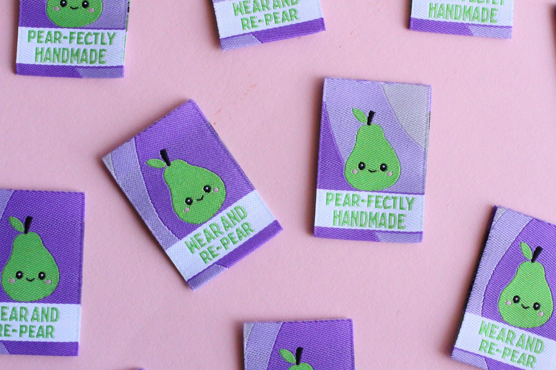 Six double-sided woven labels from PEAR-fectly Handmade by The Cosy Club Handmade, featuring intricate woven patterns.