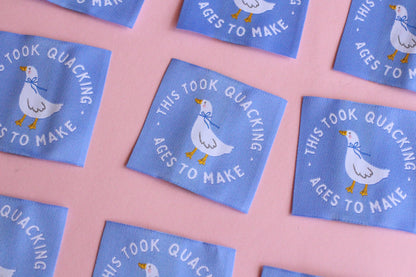 White goose sewing labels with "This Took Quacking Ages To Make" text, handmade by The Cosy Club for sewing and craft projects.