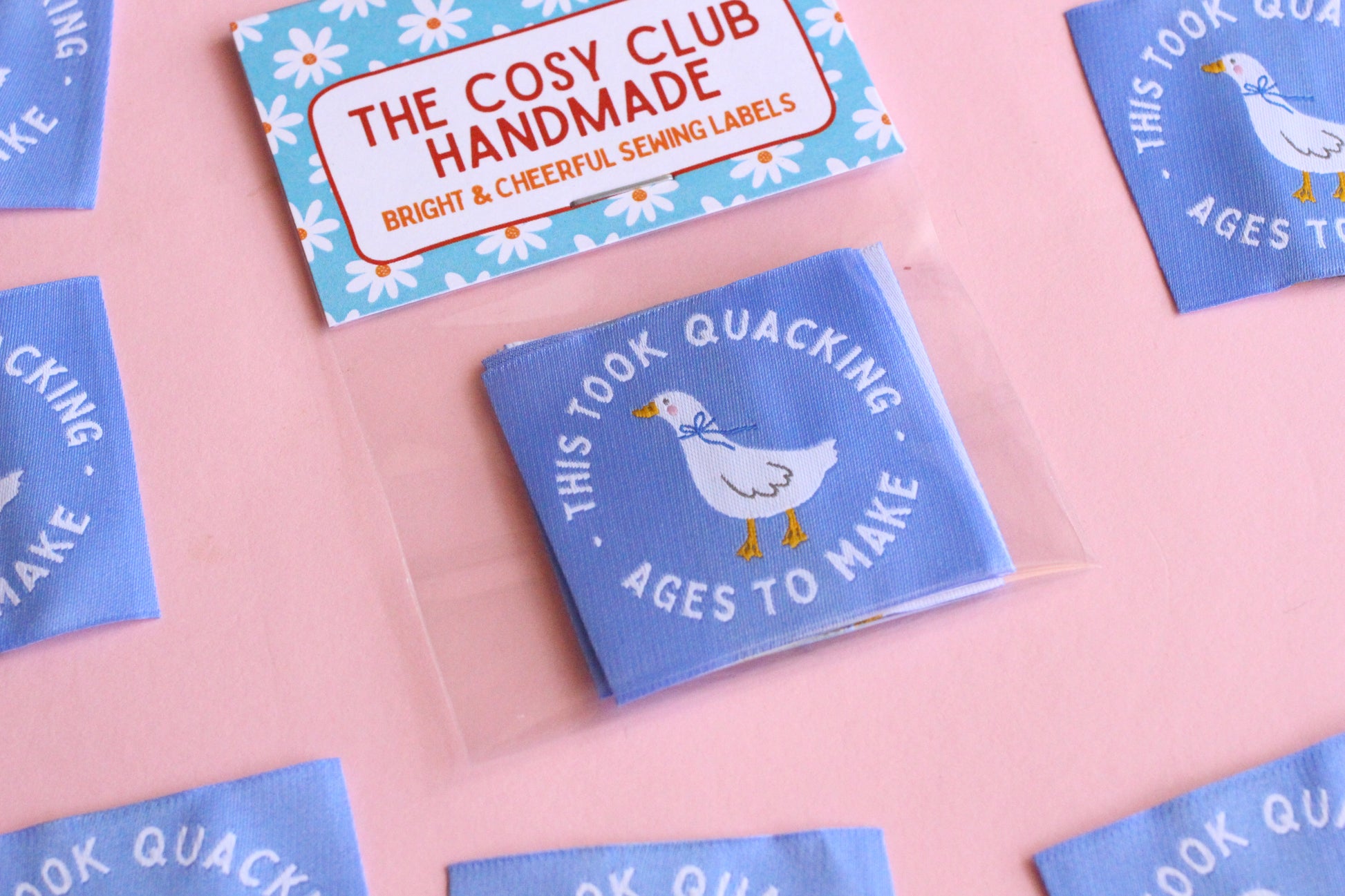 White goose sewing labels from The Cosy Club Handmade featuring "This Took Quacking Ages To Make" text for homemade craft projects.