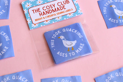 White goose sewing labels from The Cosy Club Handmade featuring "This Took Quacking Ages To Make" text for homemade craft projects.