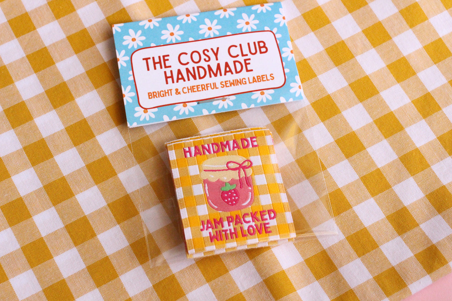 Handmade sewing labels from The Cosy Club Handmade featuring "Jam Packed With Love" for homemade jam jars.