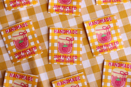 Handmade jam-themed sewing labels from The Cosy Club Handmade, featuring colorful, jam jar designs for craft projects.