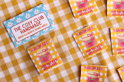 Handmade jam-packed with love sewing labels by The Cosy Club Handmade, featuring five homemade jam-themed fabric labels.