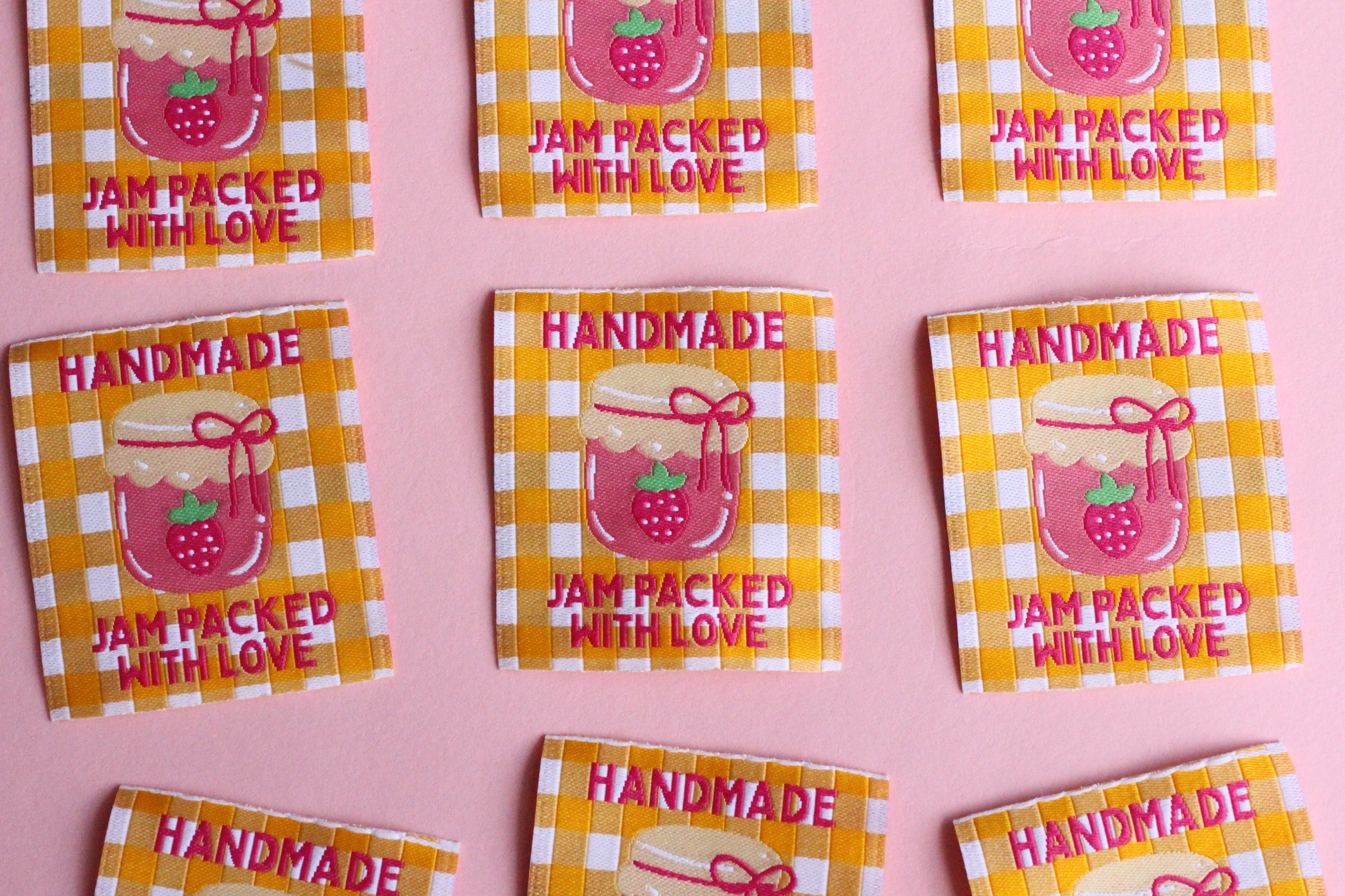 Handmade sewing labels with "Jam Packed With Love" from The Cosy Club Handmade, featuring colorful, decorative fabric labels.