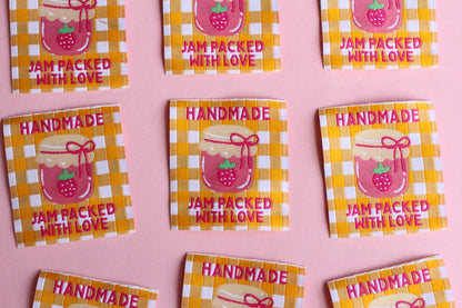 Handmade sewing labels with "Jam Packed With Love" from The Cosy Club Handmade, featuring colorful, decorative fabric labels.