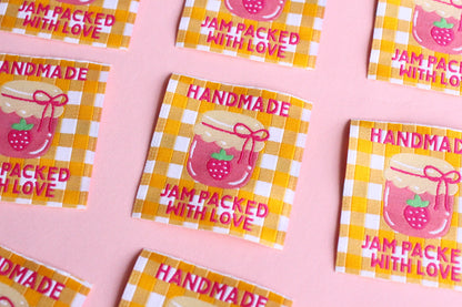 Handmade Jam Packed With Love sewing labels by The Cosy Club Handmade, featuring five charming homemade jam-themed fabric labels.