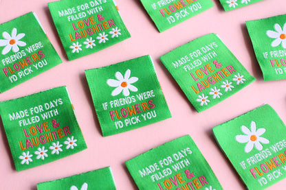 Double-sided woven label with "If Friends Were Flowers, I'd Pick You" message, by The Cosy Club Handmade, featuring floral design.