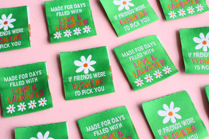 Double-sided woven label with "If Friends Were Flowers, I'd Pick You" by The Cosy Club Handmade, featuring colorful floral design.