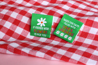 Double-sided woven label featuring "If Friends Were Flowers, I'd Pick You" by The Cosy Club Handmade, with floral design and soft colors.