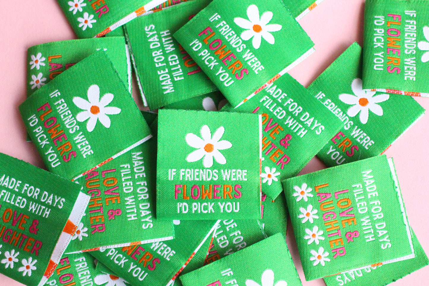 Double-sided woven label from The Cosy Club Handmade with "If Friends Were Flowers, I'd Pick You" message and floral design.