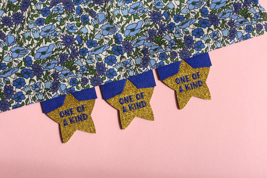 Star Sewing Labels: Metallic Gold "One of a Kind" Woven Tags (Pack of 4), Interfaced | Woven Sewing Labels for Handmade Gifts and Projects - The Cosy Club Handmade